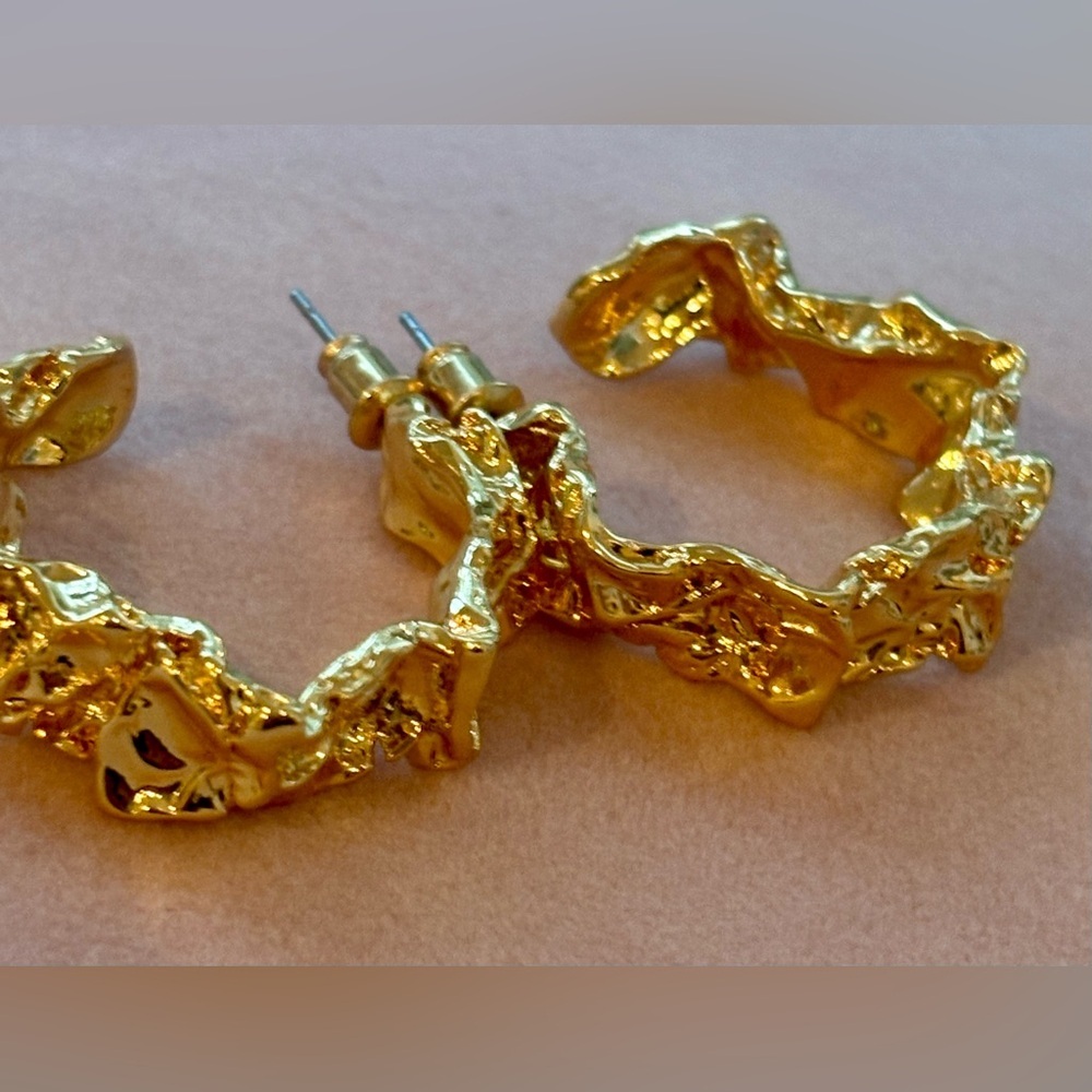 Amber Sceats 24k gold plated post hoop earrings.